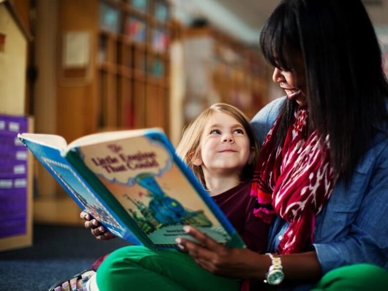 Community School Teacher Reading to Student